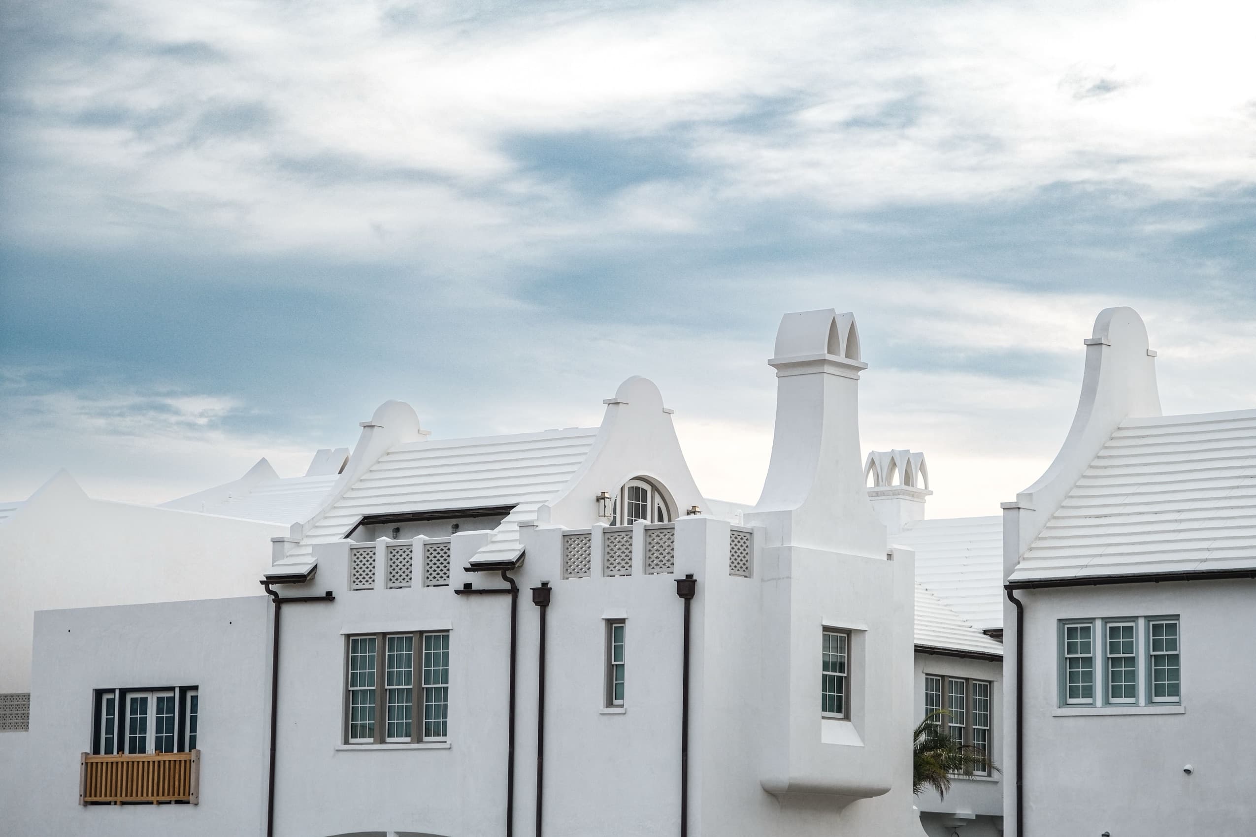 White masonry courtyard homes in Alys Beach, FL along 30A